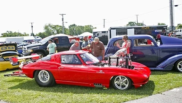 A red Corvette Sting Ray among the show cars