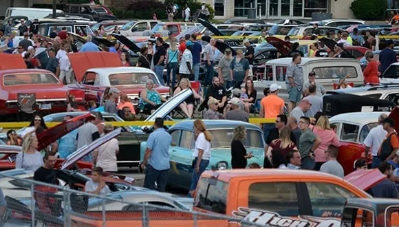 Packed rows of classic cars and spectators